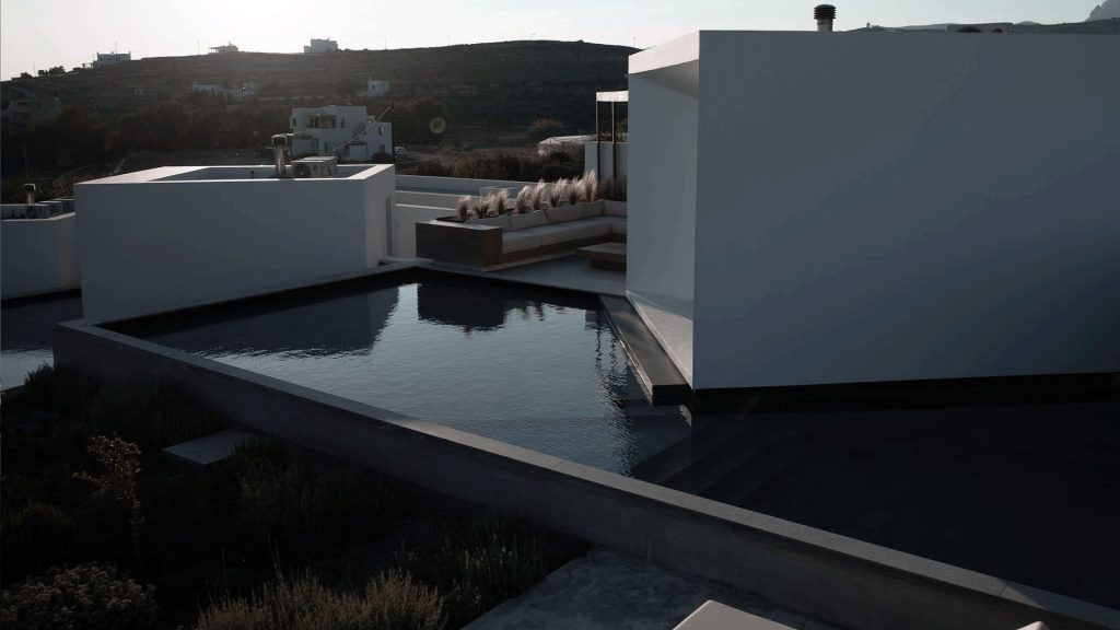 DesignBoom - Perched on the sun-drenched island of Tinos, Greece, Pnoes by Aristides Dallas Architects is a design-forward retreat on the Cycladic island. This cluster of villas, equipped with private pools and gardens, channels the primal elements of earth, wind, and water of the island to create a multisensory experience of relaxation and renewal.